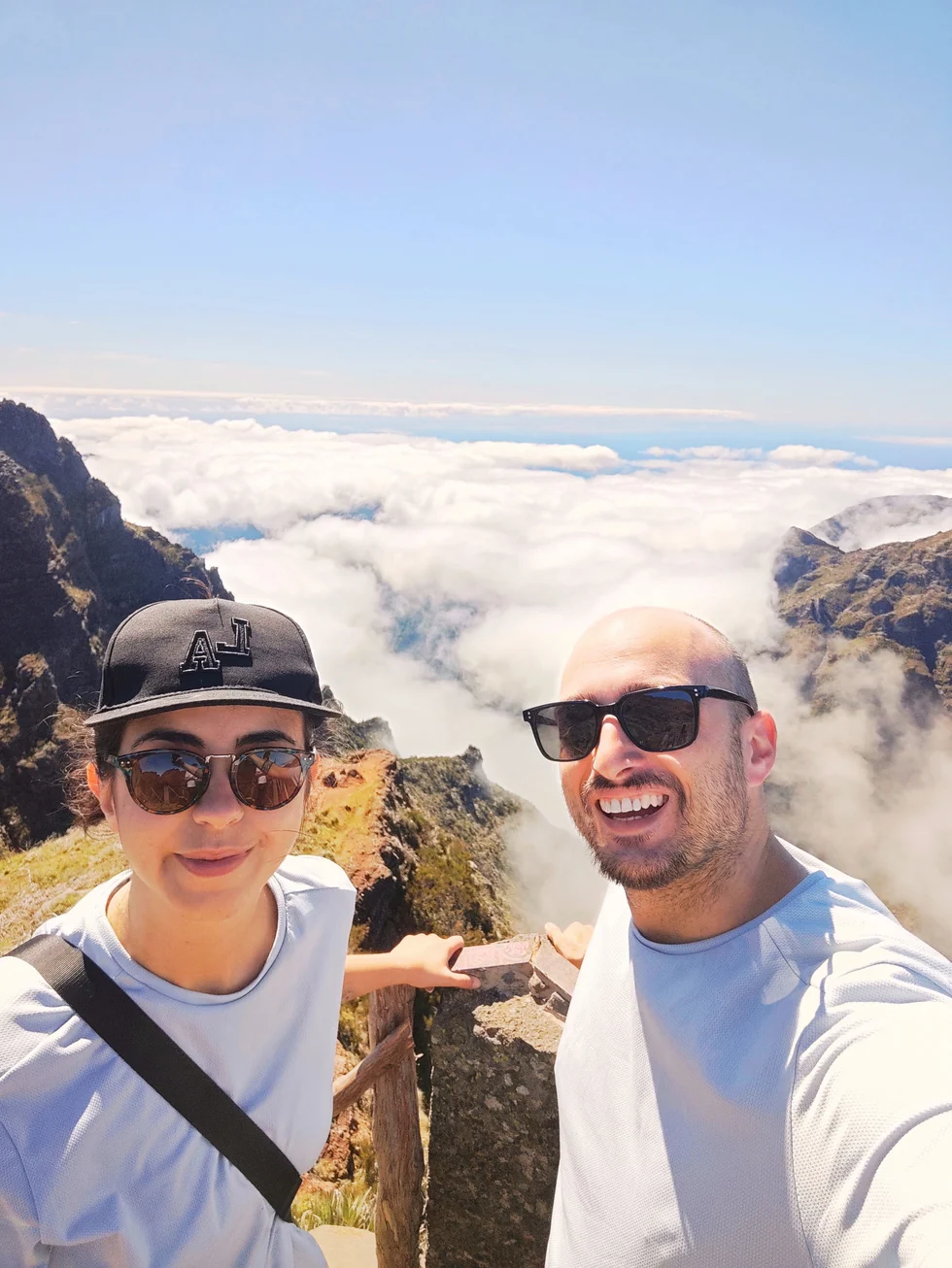 Valentina and Ivan above a sea of clouds in the mountains